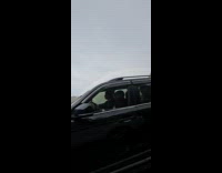 Rainbow arch on mountain road rain weather
