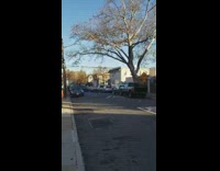 Guy in santa outfit drives by in christmas design convertible