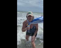 Mom and her friends give a weather report of Hurricane Dorian at the beach