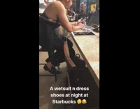 a wetsuit  n dress shoes at night at starbucks
