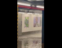 Man shows water bursting from subway ceiling