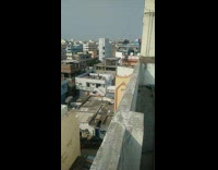 Kid blue shirt fly kite on roof