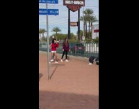 Three girls hands behind head dance street