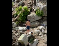 Guy pretends to shotgun red bull rock 