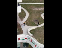 Collab IITW - Man and Woman with black yellow and pink jacket tiktok dance at the park walkway