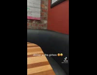 Woman shows big booth at restaurant but only one person sitting