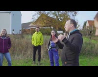 Group of people build large balloon filled with helium