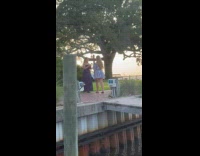 Collab IITW - Two women poses on dock at sunset