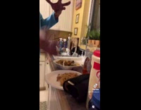 Guy sprays water on food before microwaving 
