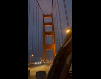 Car pass by Golden Gate Bridge tower