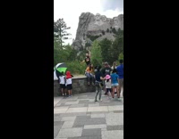 Guy films exercise video crowded area tourists