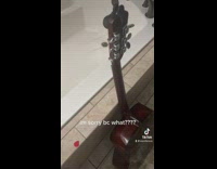 Brown guitar dropped on bathtub makes nice sound 