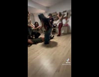 Woman falls on floor doing superman challenge