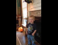 Boy laugh so hard fell near fireplace