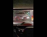 Two women tiktok dance inside the car