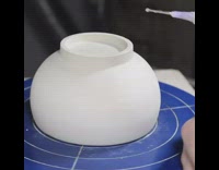 Clay Bowl on Blue Wheel Has White Dots Put On The Bottom
