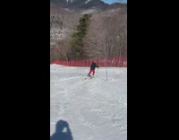 Guy does somersault before skiing down mountain 