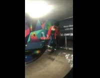 Skater falls on her side from small ramp 