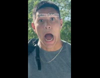 Woman surprising boyfriend with slickback hairstyle