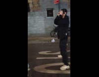 Man wearing pig nose and ears while playing badminton