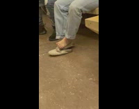 Guy rest his foot while travel inside train subway 
