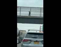 Collab WINY - Man dance on footbridge over the highway