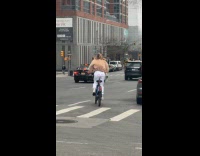 Woman ride bike wear period pants street