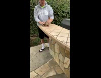 Grey north face sweater guy holds duck