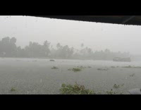 Houseboat on the river with a strong rain