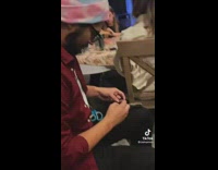 Shirtless cat with guy wearing beanie 