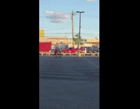 Girl red shirt pants ride shopping cart