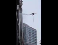 Submitter shows drone washing building at city