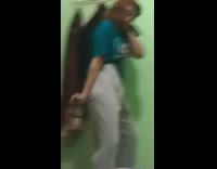 Girl dances in room while friend laughs 