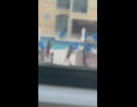 Lady in black bikini grabs her boobs for photo 