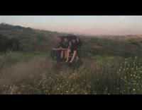 Guy drives black golf cart with flames 