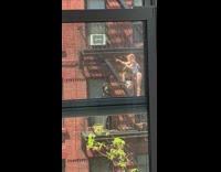 Two women in their underwear at the fire escape