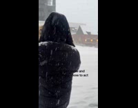 Person skiing down the road on snow