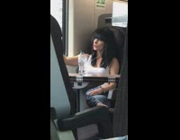 Woman duck lip selfie on metro train