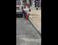 Guy whole raw chicken red bag sidewalk 