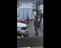 Woman taking video inside show car