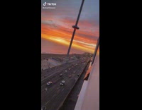 Girl admiring sunset on balcony asks if she jumps