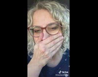 Middle aged woman walks around mall