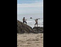 guy professional shoot rocks beach