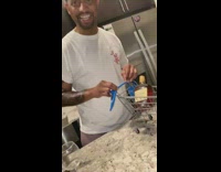 Man in kitchen small shopping cart Hennessey 