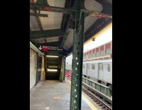 Guy stands on top of a train 