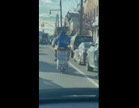 Man Rides Scooter with Dozens of Beverages