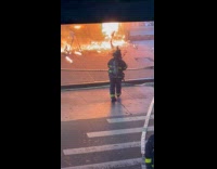 Firefighters on scene at burning shop street