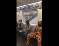 man asleep with pumpkin covered suit