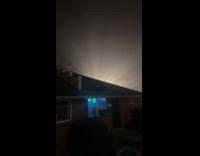 Man shows light coming from back of house