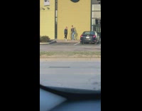 Guy dances by yellow wall tripod camera